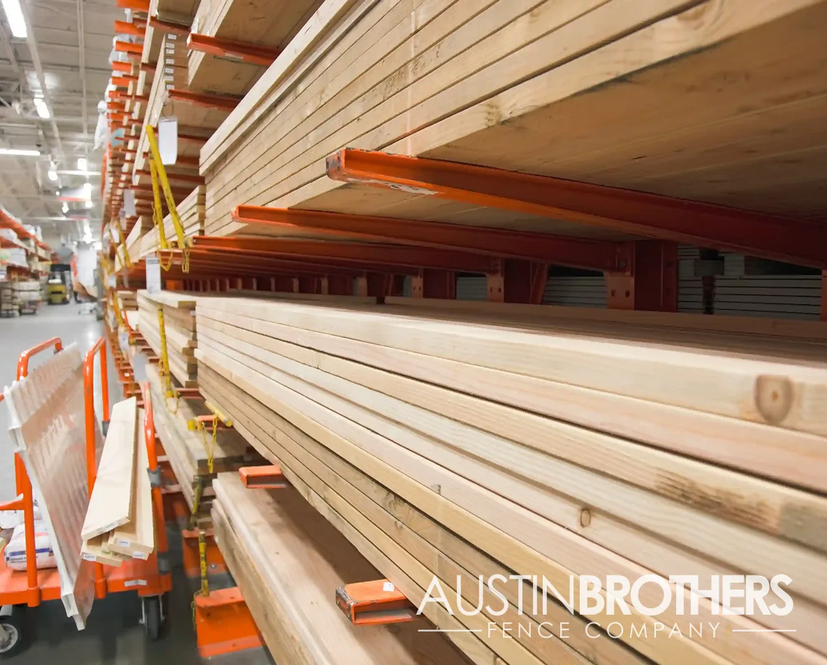Stacks of lumber on racks in a home improvement store.