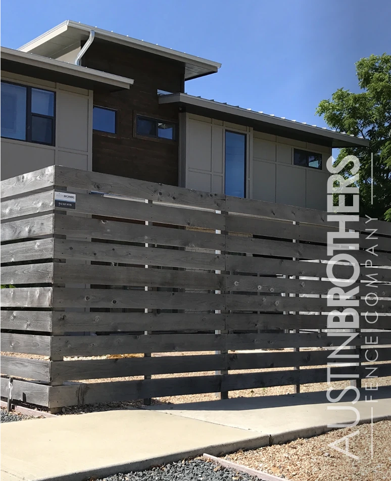 Vertical fence stained gray.