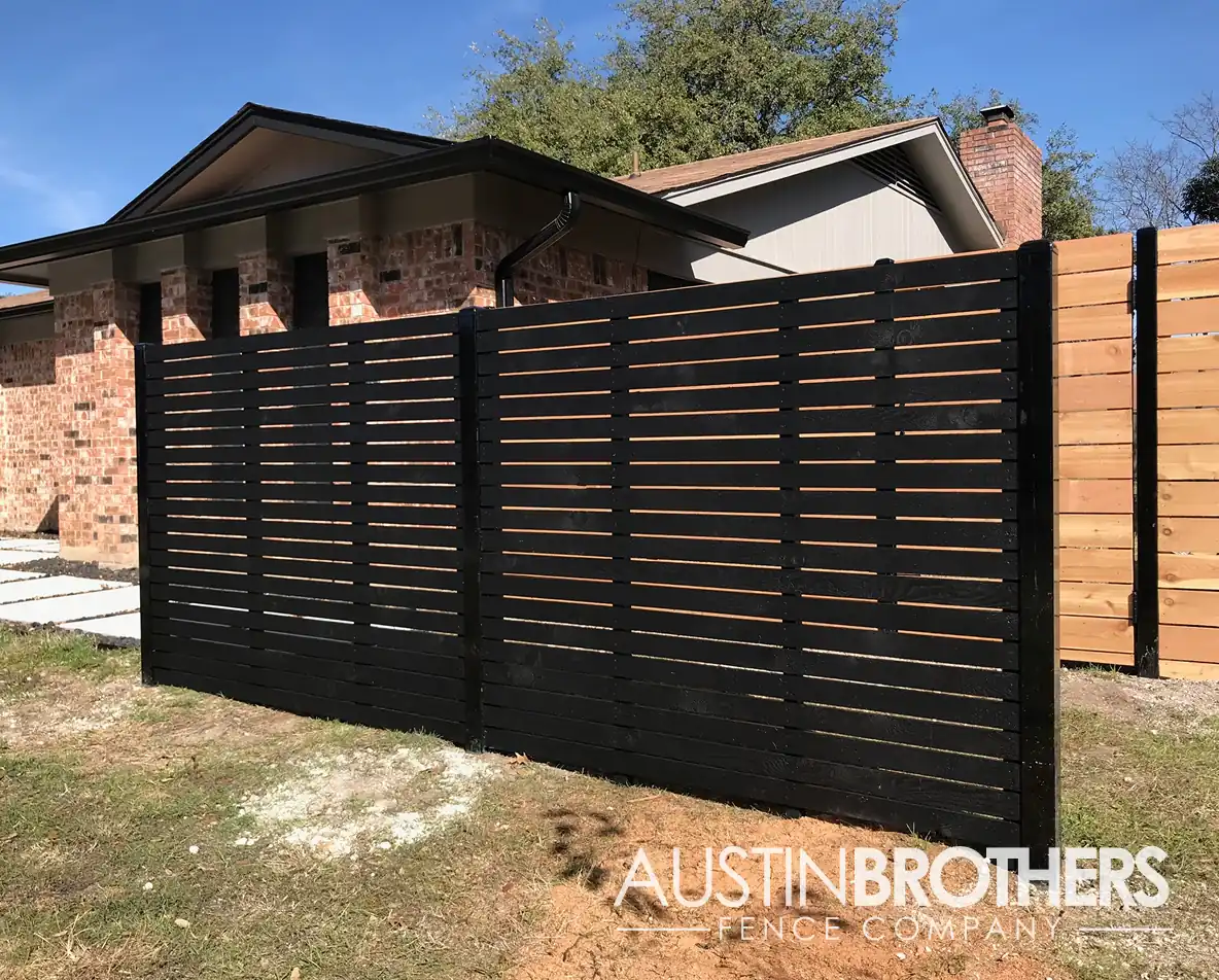 Black horizontal wooden fence.