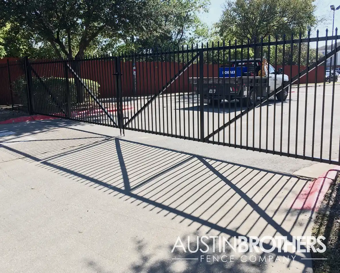 Black iron gate at the entrance to an Austin, Texas apartment complex.