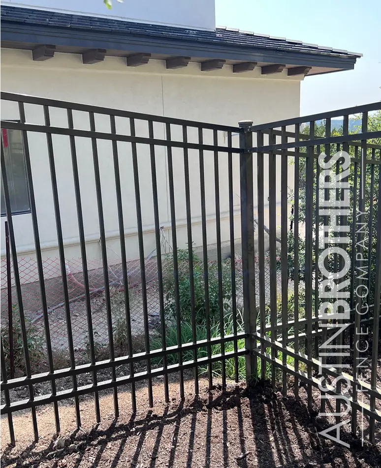 Steel gate splitting three properties in the Texas Hill Country.