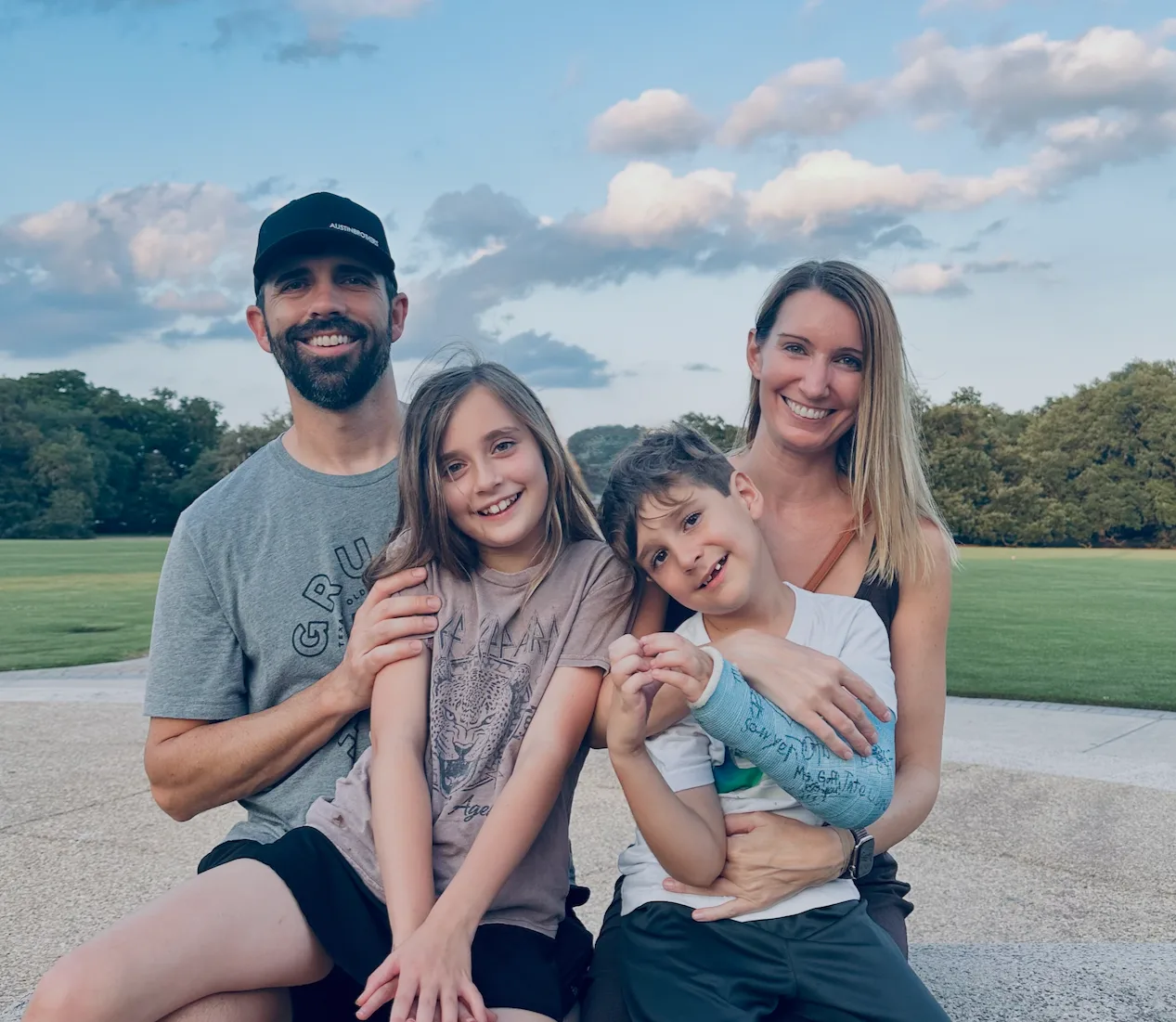 Nate and Brooke Austin with their two children in a park.